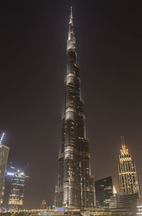 Illuminated buildings in city at night