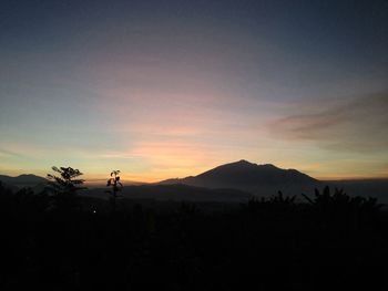 Scenic view of mountains at sunset