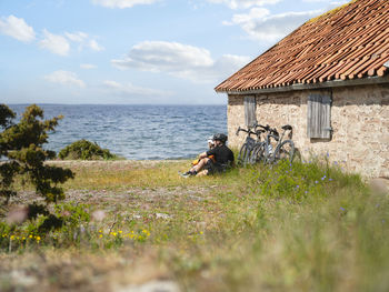 Cyclists relaxing at sea