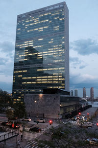 Aerial view of city street and buildings against sky