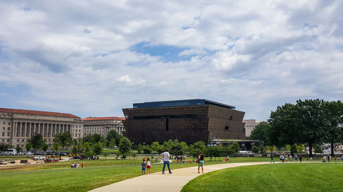 Group of people in front of historical building