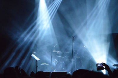 Spotlights on stage during music concert at night