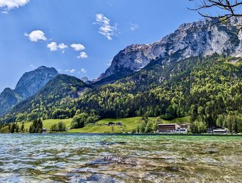 Scenic view of lake and mountains against sky