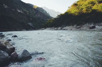 Scenic view of river in a valley