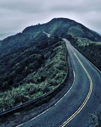 Scenic view of mountain road against sky