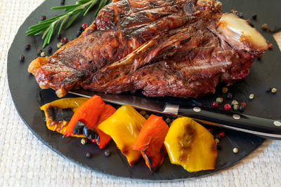 High angle view of meat on barbecue grill