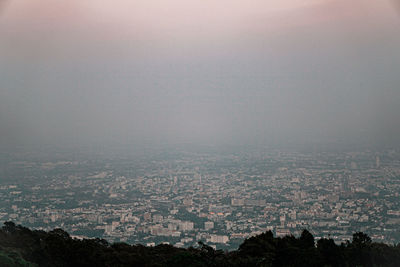 High angle view of buildings in city against sky