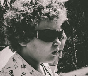 Close-up portrait of young man wearing sunglasses