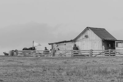 Abandoned barn on field against sky