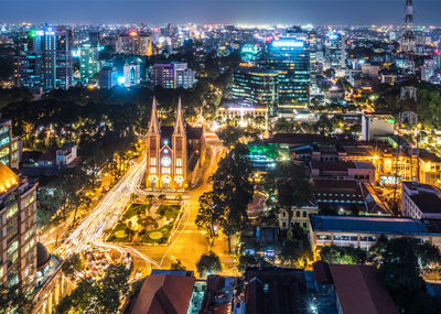 High angle view of illuminated saigon notre dame cathedral in city at night