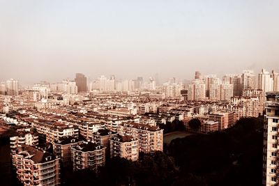 Cityscape against sky during sunset