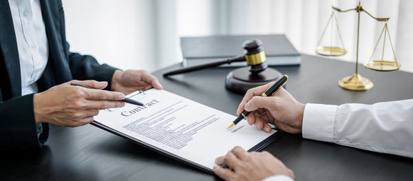 Midsection of business colleagues working in office