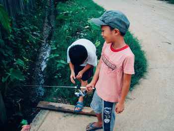 Full length of woman standing on wall