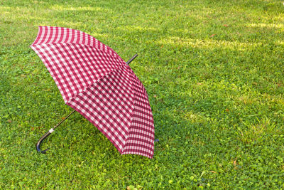 High angle view of umbrella on grassy field