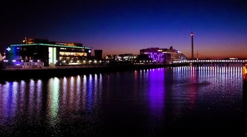 Illuminated buildings at waterfront