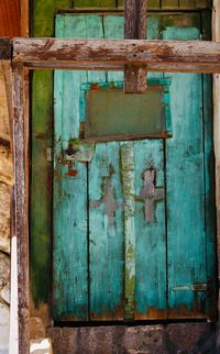Closed wooden door of old building
