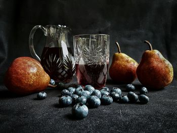 Pears with gooseberry and jug filled with juice