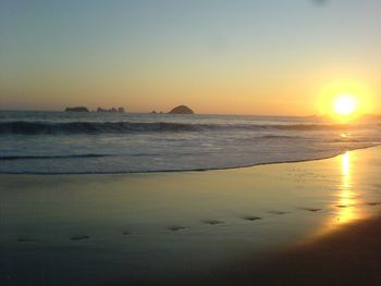 Scenic view of sea against sky during sunset