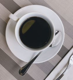 High angle view of coffee cup on table