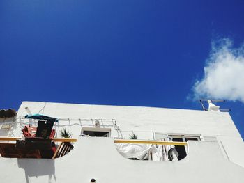 Traditional windmill against blue sky