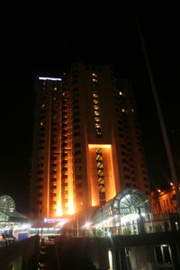 Buildings in city at night