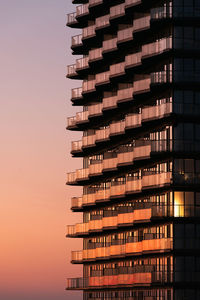 Low angle view of building against sky during sunset