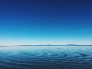 Scenic view of calm sea against clear sky