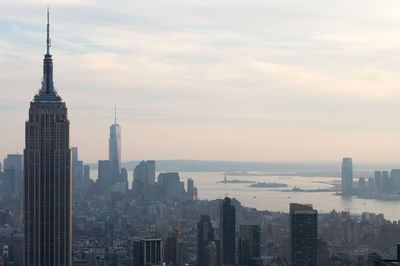 Skyscrapers against cloudy sky