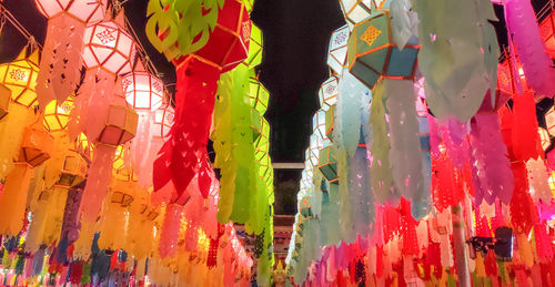 Low angle view of lanterns hanging on wall