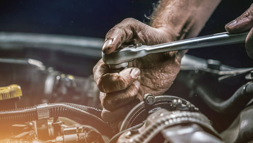 Close-up of man working at machine