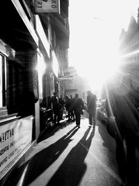 People walking on road in city