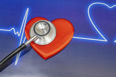 High angle view of heart shape against blue background