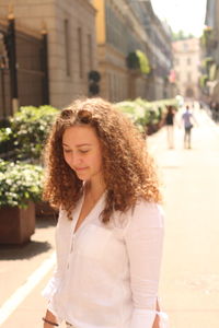 Beautiful young woman in city