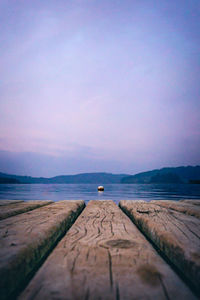 Scenic view of sea against sky at dusk