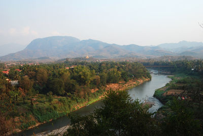 Scenic view of lake and mountains against clear sky