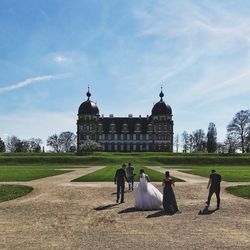 People at town square against sky
