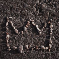 High angle view of heart shape on rocks