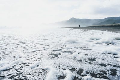 Scenic view of frozen sea against sky