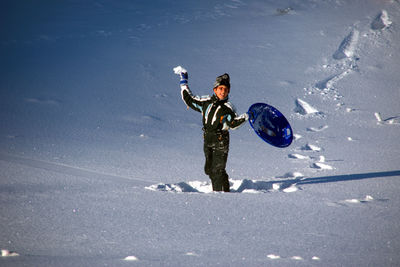 Full length of person on snow covered land