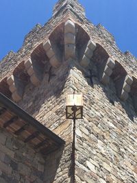 Low angle view of built structure against blue sky