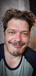 Close-up portrait of smiling young man