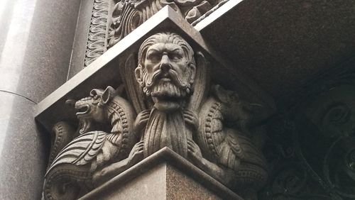 Low angle view of statue against building