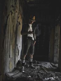 Full length of man standing in abandoned building