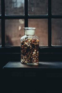 Close-up of glass jar on table