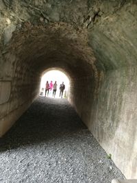 People walking in tunnel