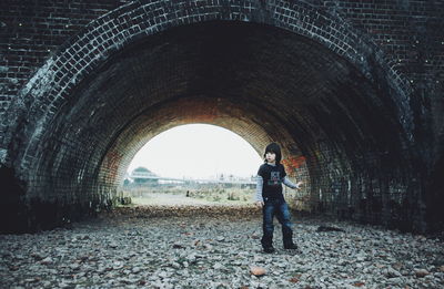 Man standing in tunnel