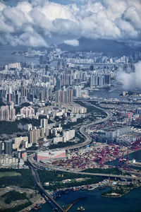 High angle view of city against cloudy sky