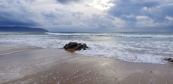 Scenic view of beach against sky