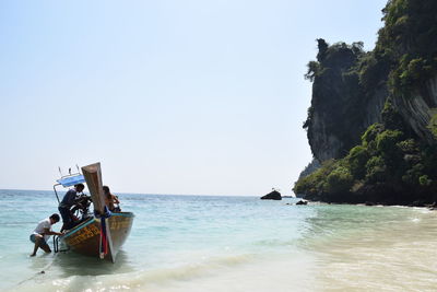 Boat in sea against clear sky