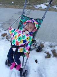 High angle view of girl playing in snow